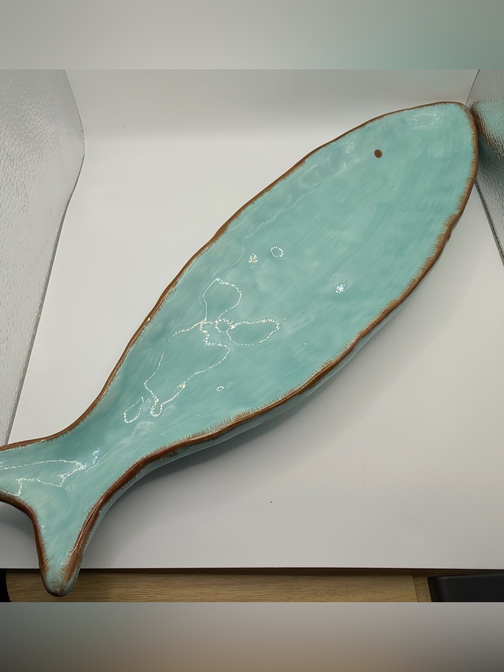 Gorgeous creative co-op ceramic aqua blue fish with brown/bronze trim.